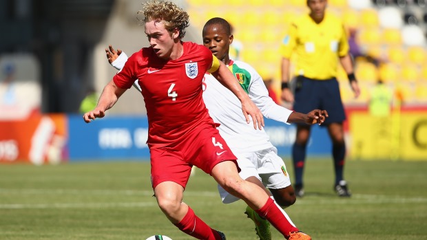 England skipper Tom Davies in action against Guinea